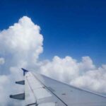 airplane-wing-sky-looking-through-airplane-window_38363-277